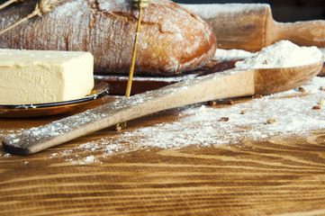 Bread and additions on a wooden table