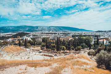 Fototapeta premium Old Greek amphitheater with city behind it