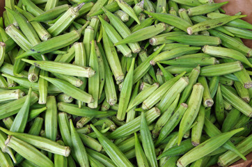 Mounds of bright green okra displayed for market 
