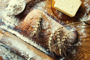Bread and additions on a wooden table