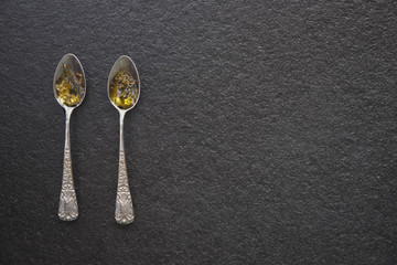 Olive oil in vintage spoons