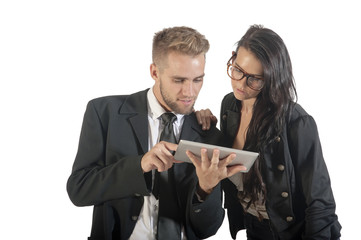 Two young business people interacting with technology.