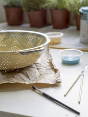 painting a recycled pot