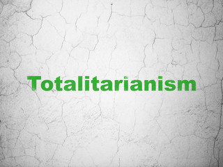 Politics concept: Totalitarianism on wall background