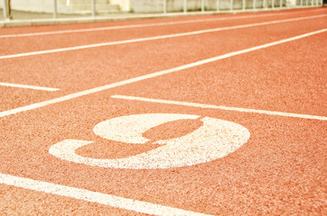 Stadium. Treadmill with number six. Sport and fitness.