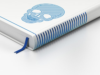 Medicine concept: closed book, Scull on white background