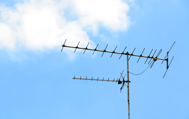 Television antenna against blue sky