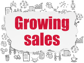 Finance concept: Growing Sales on Torn Paper background