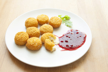 Grilled (fried) cheese Camembert with Cranberry Sauce. 