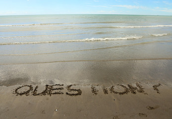 QUESTIONS written on the beach