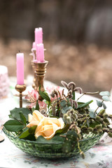 Wedding table in the woods. accessories at the wedding table. Close-up