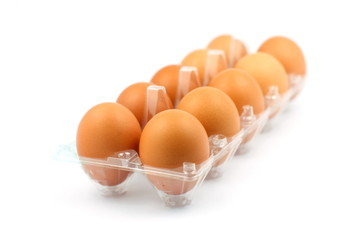 Stack of brown egg on white background