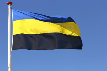 flag of Dutch province Gelderland blowing in the wind