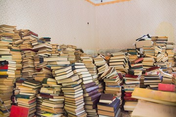 Books scattered in sloppy pile