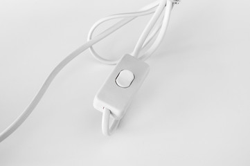lighting switch under the white background , selective focus