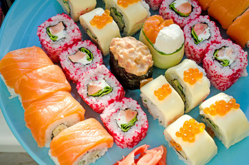 Close up of tasty fresh sushi rolls on plate