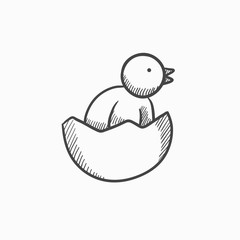Chick peeking out of egg shell sketch icon.