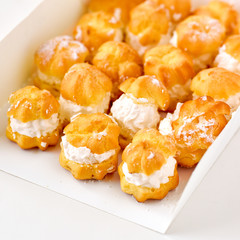 Cream puff cakes with whipped cream