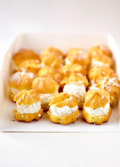 Cream puff cakes with whipped cream