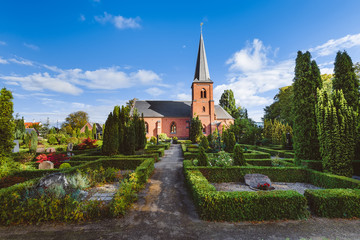 Fototapeta na wymiar City Cemetery and Catholic Church in Dragor, Denmark.