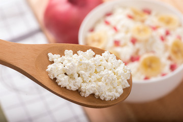 cottage cheese on a the wooden spoon