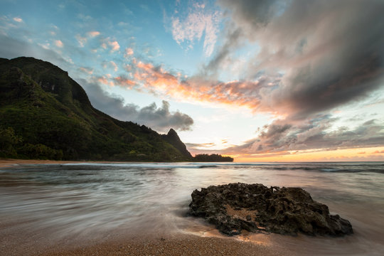 View Of Sea With Mountain During Sunset