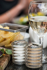 Basket of Fried Chips with a Glass of White Wine and Salt and Pe