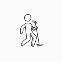 Man singing with microphone sketch icon.