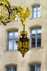 Fototapeta na wymiar Beautiful golden covered street lamp in Nancy