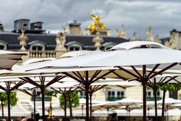 Sun umbrellas of the street cafe in Nancy