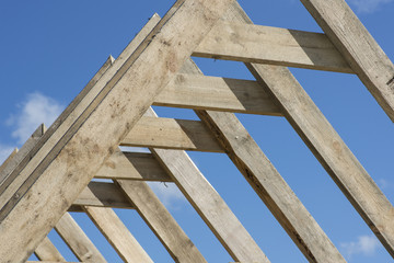 rough construction of the roof structure of the house of wood
