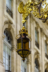 Fototapeta na wymiar Beautiful golden covered street lamp in Nancy