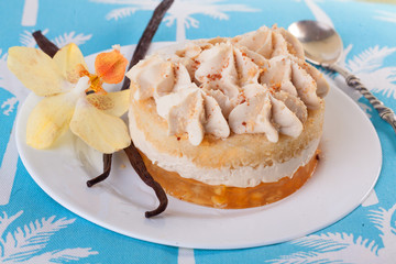 cake with vanilla, dessert, sticks, flower, orchid, on a plate close-up, cream layers