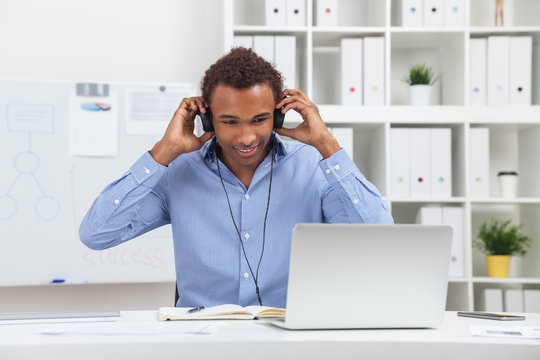 Man in headphones with laptop