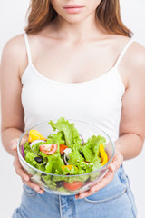 Skinny girl enjoying her salad