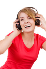 Naklejka premium Woman in big headphones listening music isolated