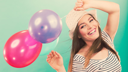 Fototapeta premium Joyful girl have fun with colorful balloons.