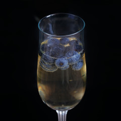 Glasses of champagne with blueberries