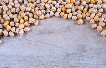 Dried chickpeas on a wooden table.