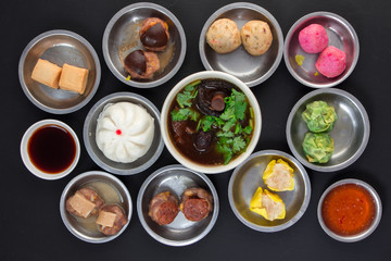 Aerial View of Various Yumcha Dimsum Set on black background