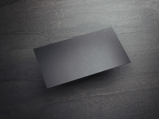 Black business card on the stone floor. 3d rendering
