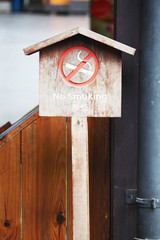 no smoking signs on wooden