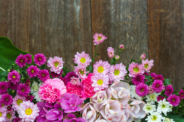 all flowers on wood background