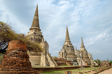 Fototapeta premium Temple ancient white grey pagoda place of worship famous in wat phra sri sanphet,ayutthaya, thailand