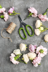 Florist workplace: carnations and roses on stone