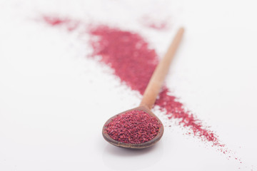 Sumac spice on white background