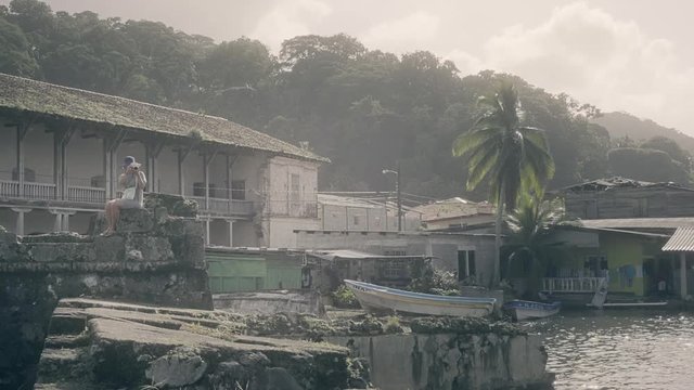 Tourist taking pictures from the Portobelo fort, Panama. 4k