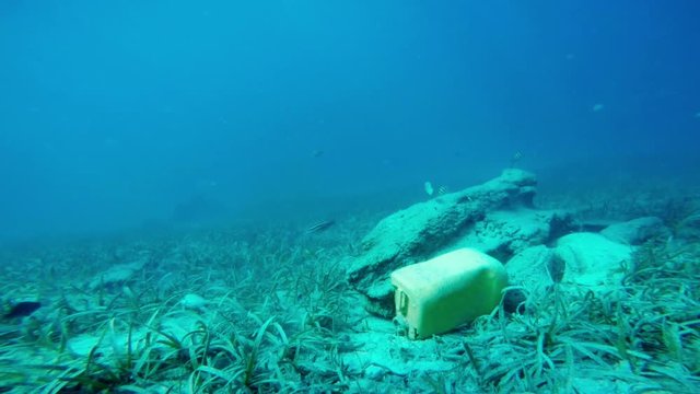 Plastic bottle on the bottom of the caribbean ocean.