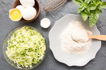 ingredients for zucchini pancakes - zucchini, eggs and flour