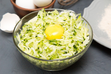 ingredients for zucchini pancakes - zucchini, eggs and flour